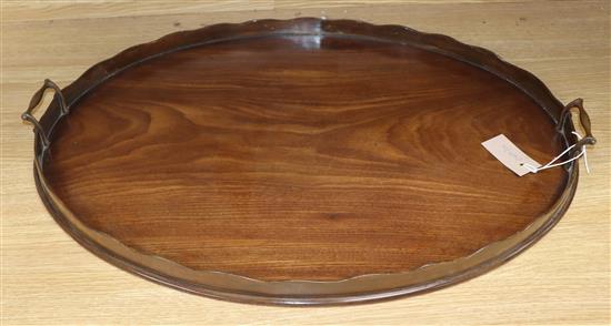 A mahogany oval two handled tray